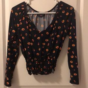 Discreet. Large. Black with yellow and orange flowers